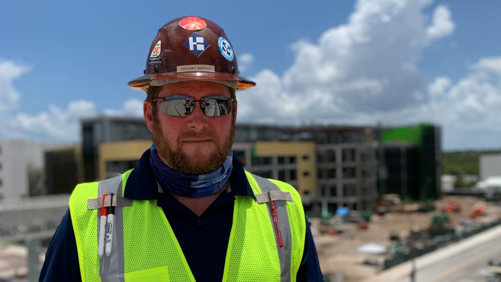 澳门足彩app's Nathan Faloon standing on a jobsite.